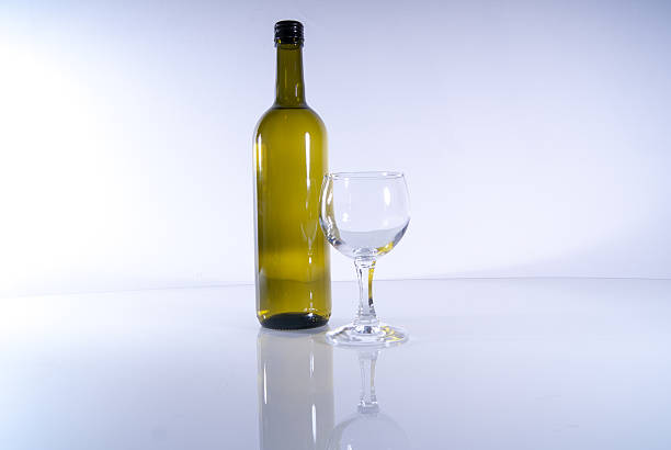 istock Green Wine bottle with glass isolated 514513261