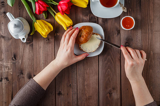 woman buttering bread