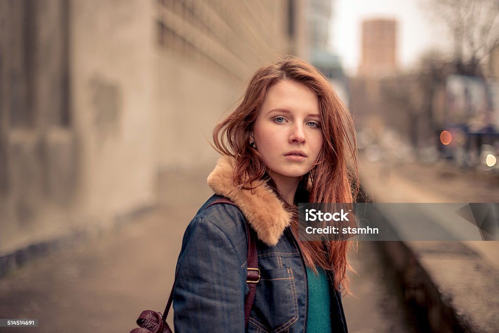 Young beauty on the urban street Portrait of the beautiful young girl on the city street Serious Stock Photo