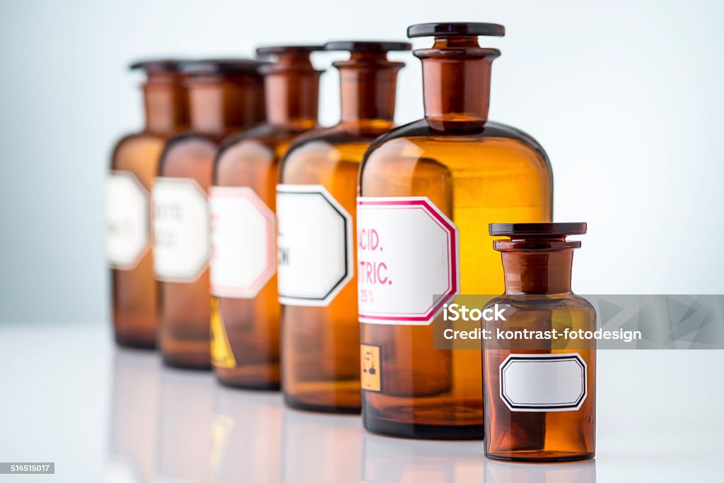 Vintage Pharmacy Drugstore Bottles in a row Vintage Pharmacy Bottles in a row with a blank label Ancient Stock Photo