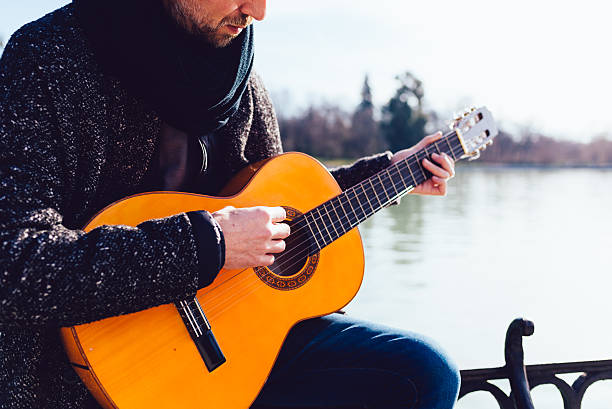 istock Guy with his Guitar in a Park 514516416