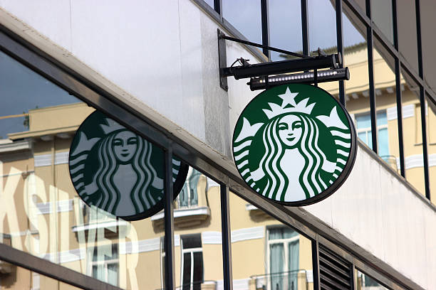 Starbucks Sign in Monaco, La Condamine Monte-Carlo, Monaco - March 9, 2016: Starbucks Sign is Displayed at the Facade of a Starbucks store. Starbucks Corporation is an American Coffee Company and the Largest Coffeehouse Company in the world with 23,450 Stores in 67 Countries restaurant mirror stock pictures, royalty-free photos & images