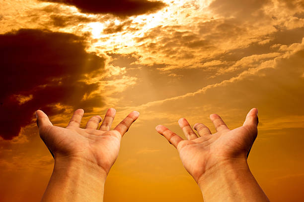 istock hands to pray or hope in  sun shine heaven 514516876