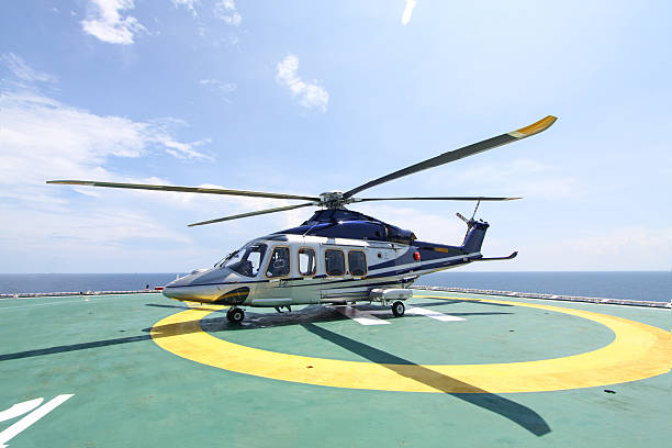 istock helicopter parking landing on offshore platform 514517657