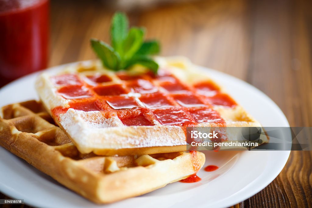 Viennese sweet waffles with strawberry jam Viennese sweet waffles with strawberry jam on the table Backgrounds Stock Photo
