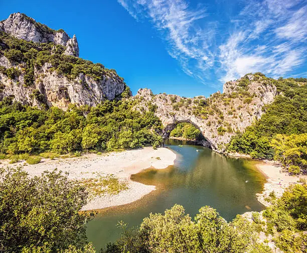 The natural landmark Pont d´Arc at the Gorges de l'Ardeche in Vallon (France). A famous sightseeing and sports destination for kayaking and swimming.
