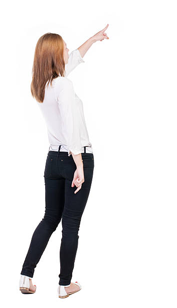 istock Back view of  pointing woman. 514519379
