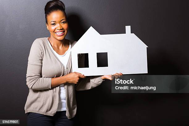 Young Woman Holding White Paper House Stock Photo - Download Image Now - Adult, Adults Only, African Ethnicity