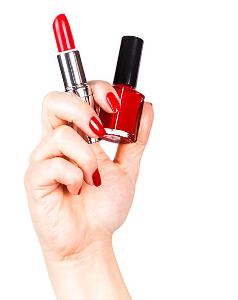 istock lipstick and nail polish in a hand 514520570
