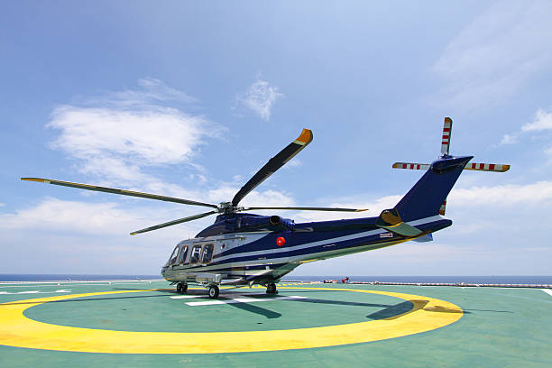 istock helicopter parking landing on offshore platform. 514520593