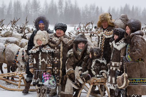  Iengra, Neryungri District, Yakutia, Russia. - March 5, 2016: March 5, 2016 Evenk family in national costumes at the celebration of the Reindeer