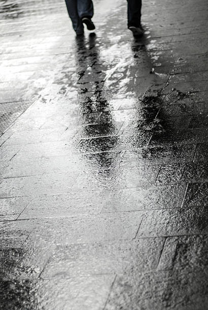 istock Wet stone sidewalk pavement street 514521262