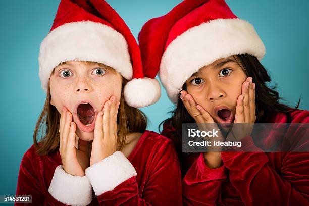 Santas Little Helpers With Surprisedshocked Look On Their Faces Stock Photo - Download Image Now