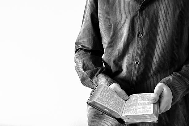 istock Man Holding Open Bible, Black and White 514531347