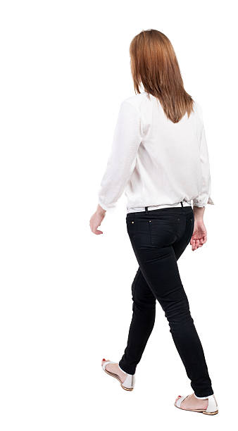 istock back view of walking  woman in jeans. 514531443