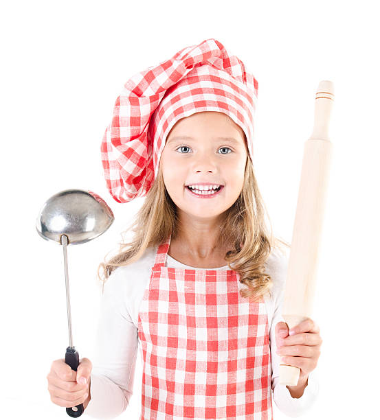 istock little girl in chef hat with ladle 514531473