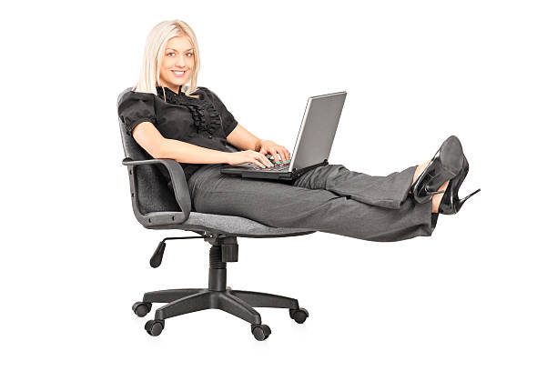 Relaxed woman working on laptop