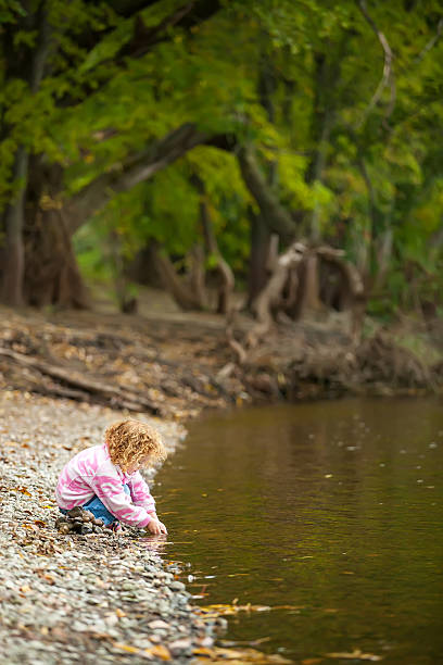 istock Girl Playing on Riverbank 514534259