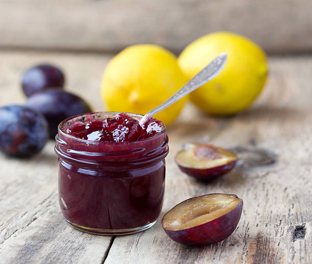 istock plum jam in glass jar and lemon on rustic wooden 514536949