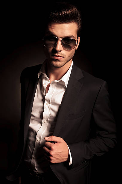 istock cool young man in suit and sunglasses 514537517