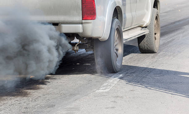 istock Air pollution from vehicle exhaust pipe on road 514551420