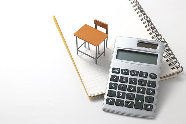 Notebook, calculator, pencil and miniature desk. Notebook, calculator, pencil and miniature desk on white background. high school enrollment stock pictures, royalty-free photos & images