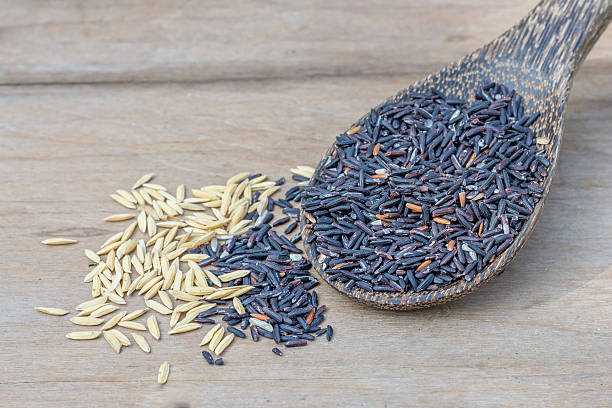 istock rice berry in wood spoon on wood background 514552884