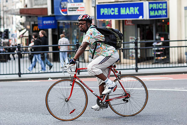 Liverpool, England - August 10, 2008: A man riding his bike in Liverpool city center