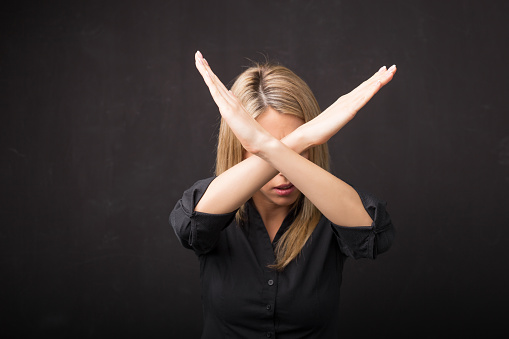 Woman showing x sign with her hands