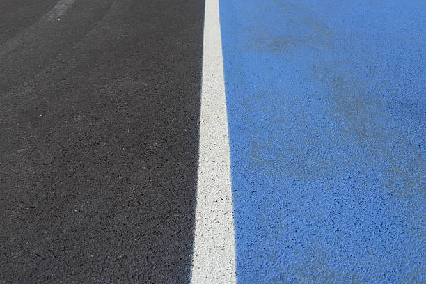 istock An asphaltic new road and two different colored lane. 514556044