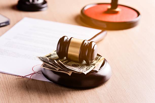 istock Money under the judge's gavel 514556338