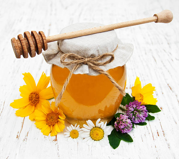 istock Honey and wild flowers 514556652