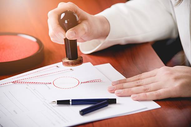 istock Woman Notary Public stamping the contract 514556872