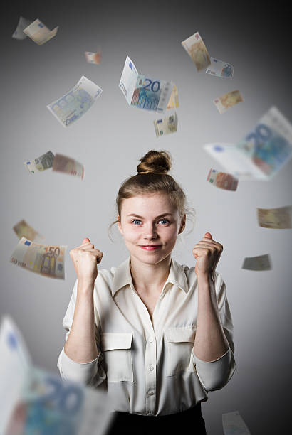 istock Rejoicing. Girl in white and Euro. 514557564