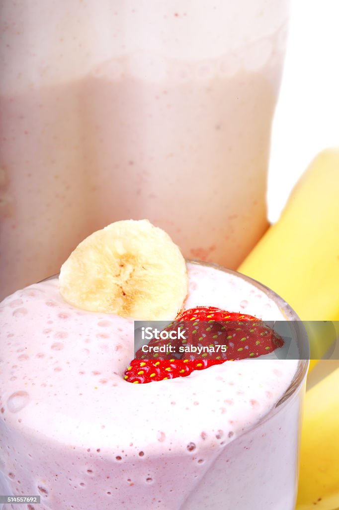 banana and strawberry smoothie on white background Backgrounds Stock Photo