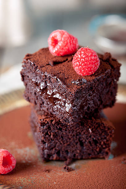 istock Brownies with raspberry on a wooden background. 514557927