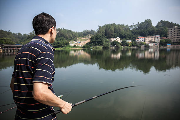 istock Asian man go fishing 514558360
