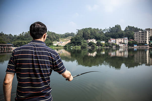 istock Asian man go fishing 514558430