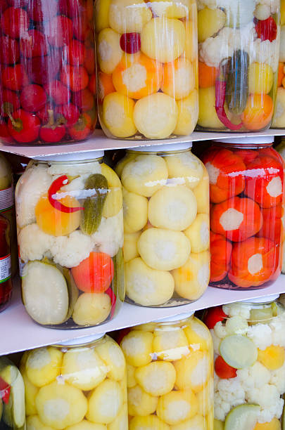 istock Mixed pickled vegetables in glass jar 514558909