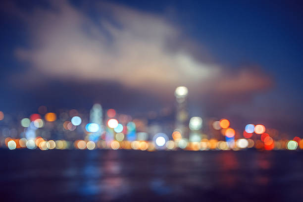 Blured lights of Hong Kong city twilight with water reflexion