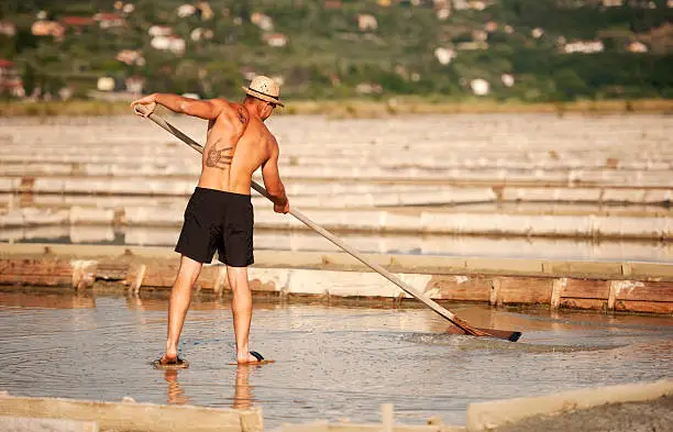 Manual worker at salt pans in Sečovlje, Portorse, Slovenia, Adriatic coast.