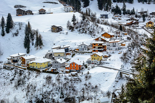Winter village with colourful cottages in suburb of Ischgl, Austria.