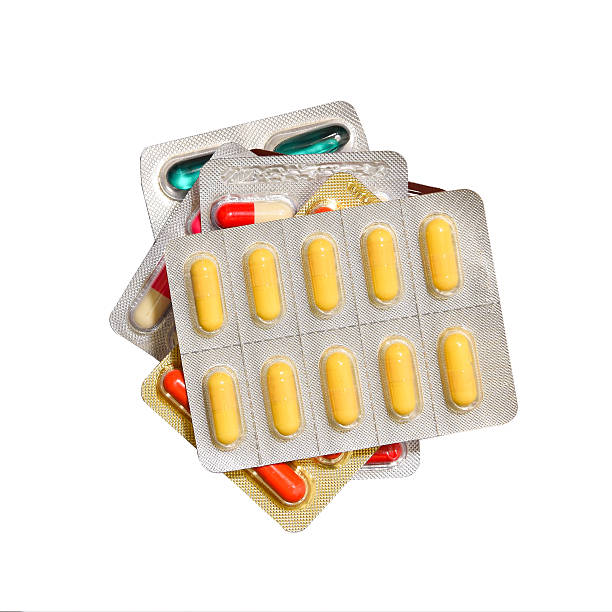 istock Heap of medication capsule  pills on a white background 514561029