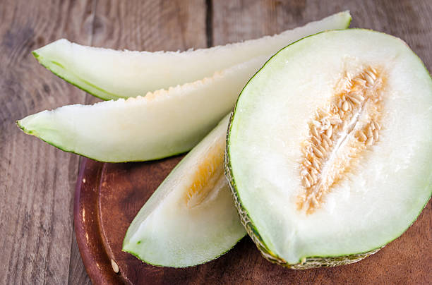 istock Piel De Sapo Melon On The Wooden Background 514561435