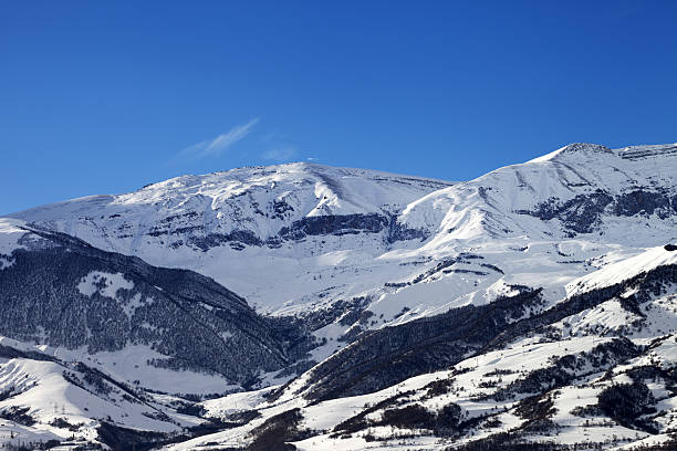 istock Snowy sunlight mountains at sun day 514562384