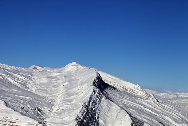istock Winter snowy mountains in nice sun day 514562470