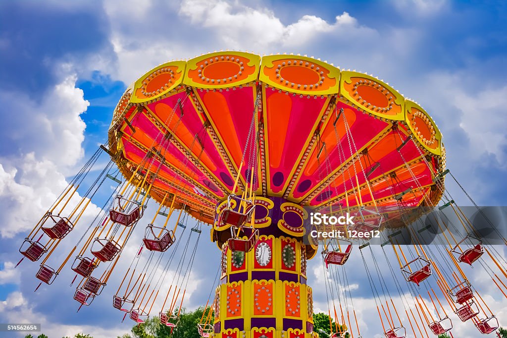 Colorful swing ride Colorful swing ride at the amusement park Traveling Carnival Stock Photo