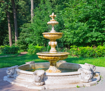 The flow of water falls into a pond