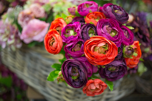 Colorful bouquet of artificial flowers with different blossoms
