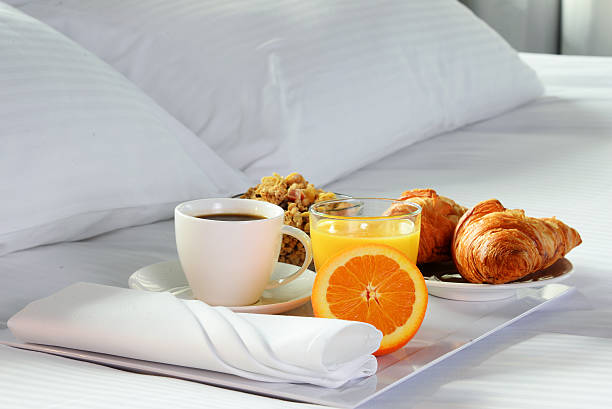 istock Breakfast in bed in hotel room. 514562982